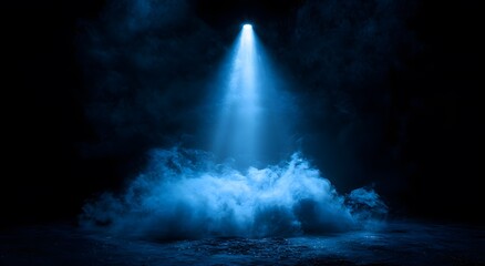 Obraz premium Dramatic blue spotlight illuminating mystical smoke in the dark