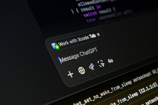 Poznan, Poland - April 14, 2025: Close-up of ChatGPT integration inside Xcode IDE with visible code editor and messaging panel