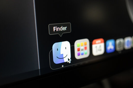 Poznan, Poland &ndash; April 14, 2025: Close-up of Apple MacOS Dock with Finder icon selected and mouse cursor hovering