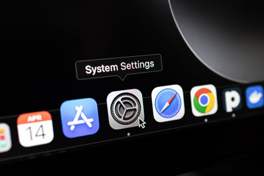 Poznan, Poland &ndash; April 14, 2025: macOS Dock with System Settings icon selected and pointer hovering over configuration app