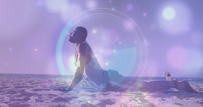 Round scanner and glowing spots of light against african american fit man performing push ups