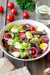 Salad with eggs, tomatoes, onions and radishes. Healthy eating. Vegetarian food.