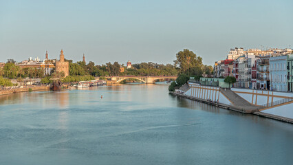 Aerial view of Seville divided by the river Guadalquivir timelapse hyperlapse