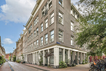 A beautifully designed modern building showcases a unique architectural style at the corner of a...