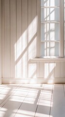 Obraz premium Serene Interior Scene with Sunlight Streaming Through Window Casting Shadows on White Wooden Wall and Floor