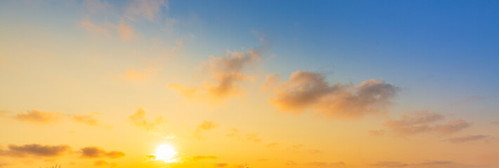 Orange sky and clouds in the morning,Beautiful Vivid sky painted by the sun leaving bright golden shades