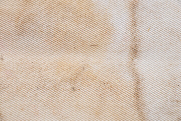 Old dirty stained white fabric close up, dirty fabric