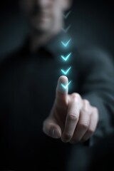 A hand touches a glowing, descending series of blue arrow icons against a dark background, suggesting digital interaction or selection