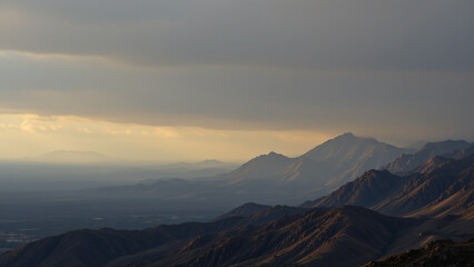 Naklejka premium The edge of the world displays a scattering of faint, golden illumination highlighting rugged terrain and barely visible geographical features still cloaked in darkness