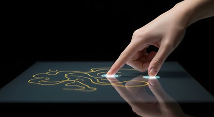 A hand touching a glowing screen with a yellow line drawing on a black background surface