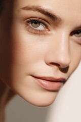 serene close-up portrait of woman's face, highlighting beauty of her features and natural skin tone