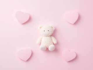 Obraz premium Minimalist White Teddy Bear with Pink Hearts - Flat Lay Top View for Mother's Day, Kids Product Promotion, Pastel Background Baby Shower Decor.