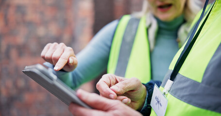 Hand, construction and people on tablet at site for inspection, progress report and expansion safety. Architect, digital and compliance check for information, project management and quality assurance