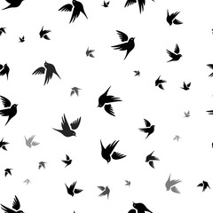 Seamless vector pattern with bird symbols, creating a creative monochrome background with rotated elements. Illustration on transparent background