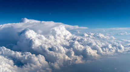 Fototapeta premium Aerial view of fluffy white cumulus clouds against a deep blue sky, showcasing a vast, peaceful landscape representing freedom and serenity