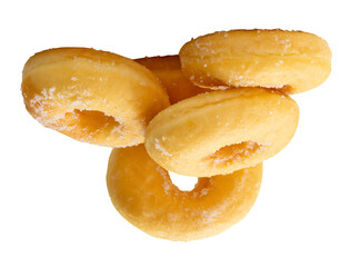 Side view of brown sugar glazed cinnamon donuts in stack isolated with clipping path in png file format