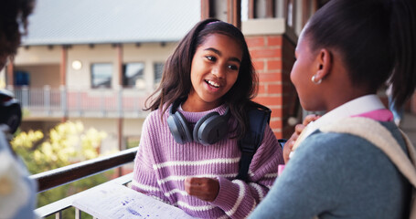 Children, friends and talking at school, books and discussion at break for test, notes and education. Kids, girl and group with advice, smile and listening for scholarship, learning and development
