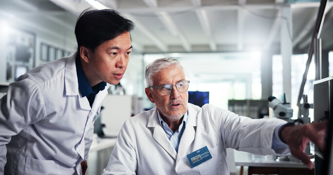 Computer, scientist and discussion with team in laboratory for healthcare, medical research or test results. Technology, men and study with biologist in clinical trial for pharmaceutical development