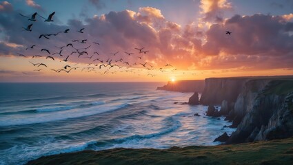Obraz premium Seascape with Birds Flying at Dramatic Sunset Over Rocky Cliffs