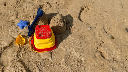 toy bucket and shovel for making sand castles on the beach