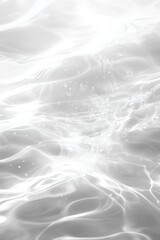 Fototapeta premium Ethereal water surface with gentle ripples and sparkling light creating a serene and calming atmosphere in a monochrome palette for peaceful backgrounds