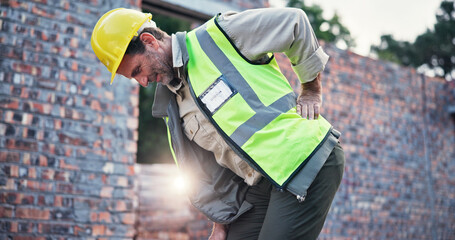Man, construction worker and back pain with injury, work site accident or spasm with burnout....