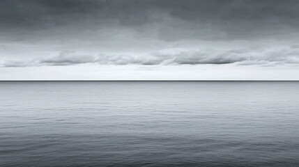 Fototapeta premium Tranquil monochrome seascape under overcast sky