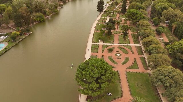 4K 60fps drone view tilting down over the lake and Rosedal (Rose Garden) in Parque General San Martin, Mendoza, Argentina