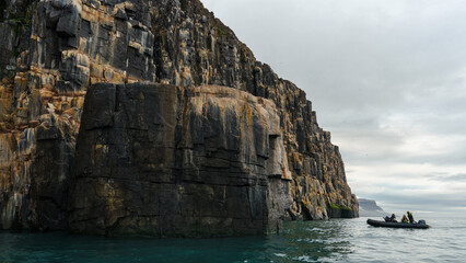 Dinghy exploring Alkefjellet. Svalbard 
