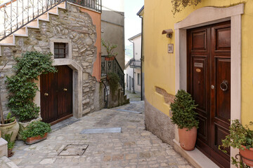 A narrow street between the old houses of San Giorgio la Molara in Campania, Italy.
