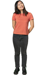 Obraz premium Full-body young Chinese woman relaxed and happy laughing, neck stretched showing teeth.