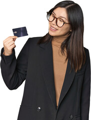 Chinese businesswoman displaying credit card in studio