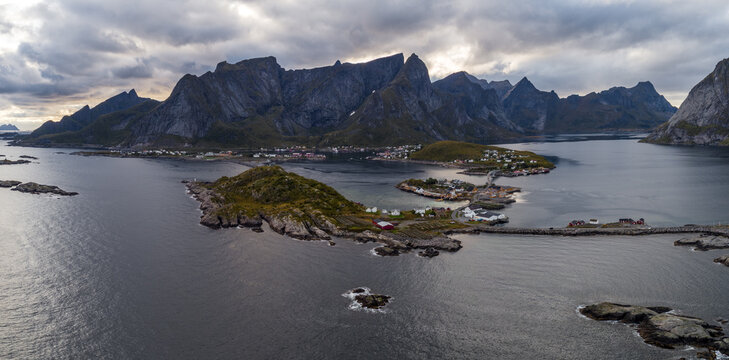 Aerial panoramic view of Lofoten coastline with fishing villages and dramatic mountains in autumn, Norway