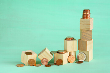 Business concept for financial growth, interest rate increase, inflation, high price, tax and tariffs rise .Wooden cube blocks and stack of coins, free  copy space