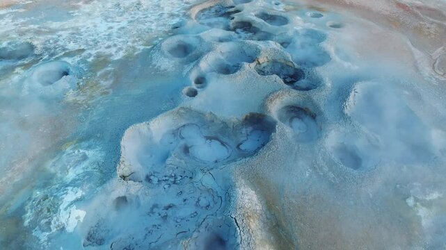 Colorful top-down view of geothermal surface activity in Hverir near Lake Myvatn, showing intense volcanic chemistry in action.