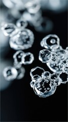 Delicate, translucent bubbles float against a dark backdrop, capturing light and creating a shimmering, ethereal effect