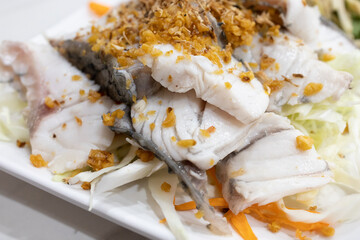 Top view of Steam Red Snapper fillet with seafood spicy dipping , focus selective