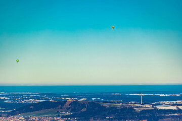 Alpine winter view with many hot air balloons at Bad Kohlgrub, Garmisch-Partenkirchen, Bavaria, Germany