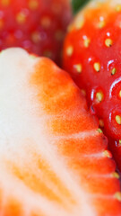A macro shot of fresh strawberries, highlighting their vibrant red color and juicy texture