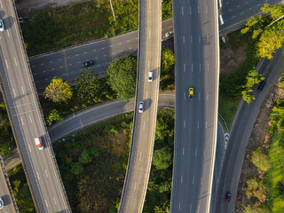 Fototapeta premium Aerial view city transport junction cross road with vehicle movement