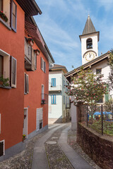 Narrow street in the historic center of Vira Gambarogno, in the district of Locarno, Ticino, Switzerland.
