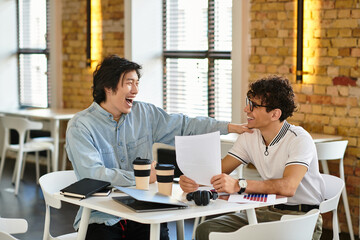 Friends enjoying a productive work session in a bright and modern office environment together