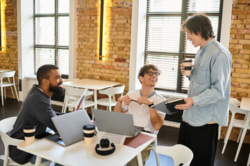 Collaborative workspace energizes creativity among diverse professionals enjoying coffee