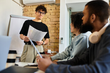 Team members gather around a table discussing innovative ideas while collaborating on projects