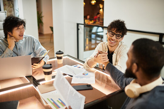 Collaborative brainstorming session among diverse colleagues in a modern office workspace