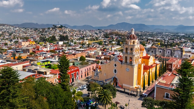 Aerial view of the church of the magic town of Atlixco (Puebla, Mexico) with hills in the background