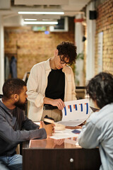 Collaborative brainstorming session among colleagues in a modern office environment