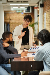 Engaging discussion among colleagues in a modern office workspace fosters teamwork and creativity