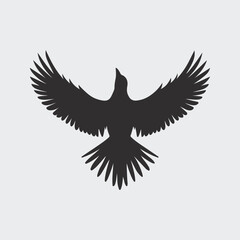 A stylized black silhouette of a bird