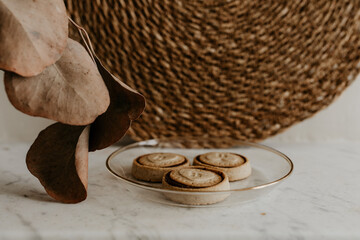 Rustic Cookie Plate with Dried Eucalyptus on Marble Background